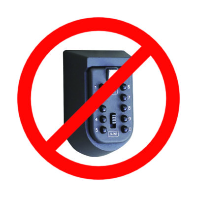 A push-button style key safe, covered with a red circle-slash "not allowed" symbol
